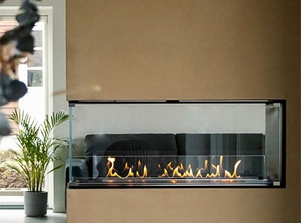 Built-in DecoFlame wall fireplace with glass surround and linear flame display in modern living room, sleek beige wall