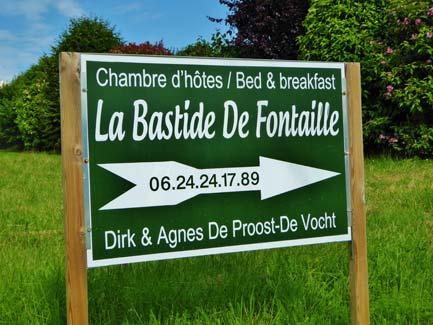 La Bastide De Fontaille bed & breakfast sign in green French countryside pointing to Chambre d'hôtes with contact number